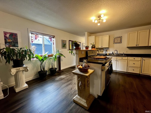 1326 W Main St, Fort Wayne, IN 46808 - kitchen with dark countertops, dark wood-style floors, and a textured ceiling