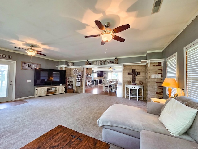 106 N Park Ave, Fowler, IN 47944 - living room featuring ceiling fan, a wood stove, carpet, and crown molding