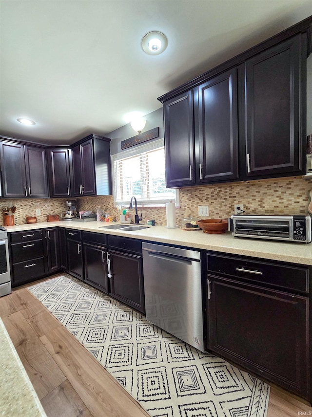 106 N Park Ave, Fowler, IN 47944 - kitchen with stainless steel dishwasher, light countertops, backsplash, and electric range