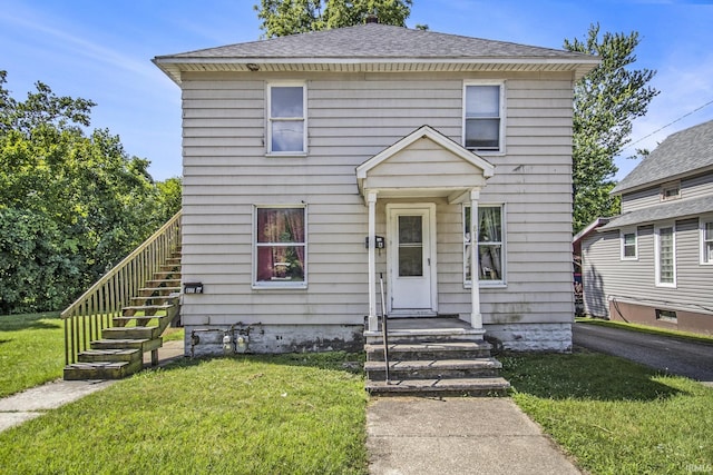 817 Middlebury St, Elkhart, IN 46516 - american foursquare style home featuring a front yard, stairway, and roof with shingles
