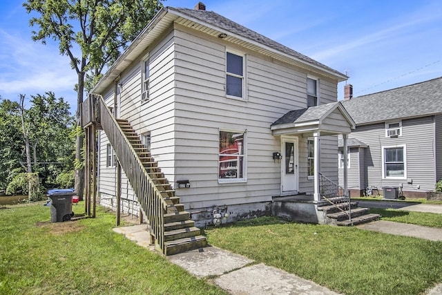 817 Middlebury St, Elkhart, IN 46516 - view of front of property featuring a front yard and stairs