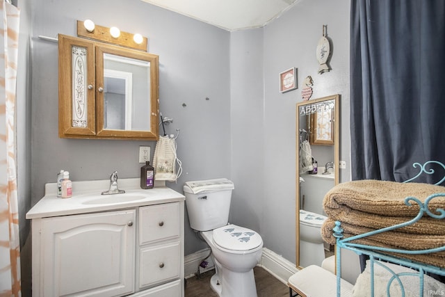 817 Middlebury St, Elkhart, IN 46516 - half bathroom with vanity and wood finished floors