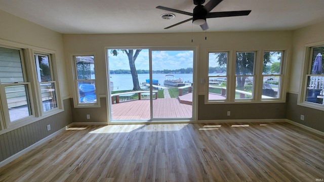 8121 N Tippecanoe Dr, Walkerton, IN 46574 - unfurnished sunroom with a water view