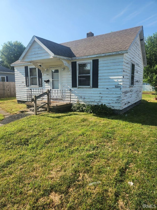 919 E Havens St, Kokomo, IN 46901 - view of front of home with a chimney and roof with shingles