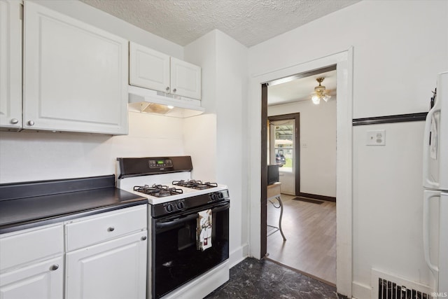 913 W Hubbard Ave, Elkhart, IN 46516 - kitchen featuring white appliances, under cabinet range hood, white cabinetry, a ceiling fan, and a textured ceiling