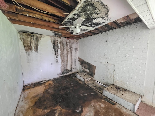 722 N Main St, Sullivan, IN 47882 - detailed view of ceiling fan, concrete flooring, and brick wall