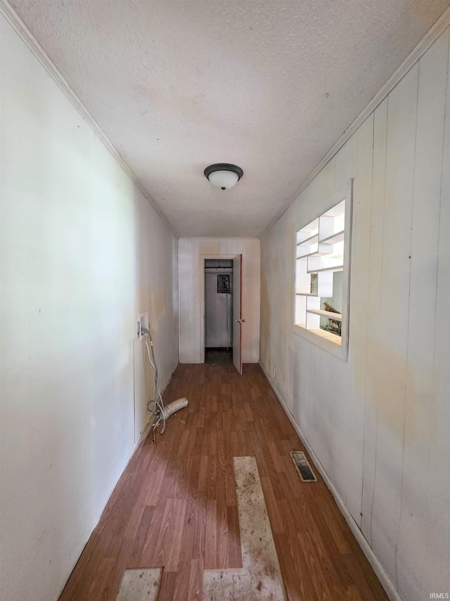 722 N Main St, Sullivan, IN 47882 - hallway featuring a textured ceiling, ornamental molding, and wood finished floors