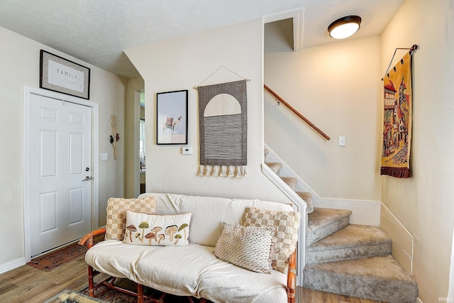 1931 Morton St, Lafayette, IN 47904 - living room featuring wood finished floors, stairway, and a textured ceiling