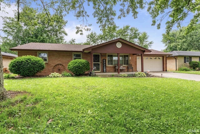 3331 Loral Dr, Anderson, IN 46013 - single story home featuring a garage, covered porch, concrete driveway, and brick siding