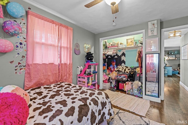 3331 Loral Dr, Anderson, IN 46013 - bedroom featuring wood finished floors, a closet, and a ceiling fan