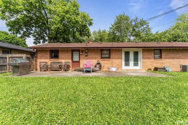 3331 Loral Dr, Anderson, IN 46013 - rear view of house featuring french doors, a patio area, and brick siding