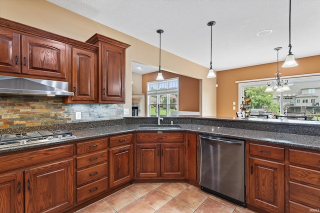 57907 Stone Creek Ct, Goshen, IN 46528 - kitchen featuring appliances with stainless steel finishes, extractor fan, decorative light fixtures, and decorative backsplash