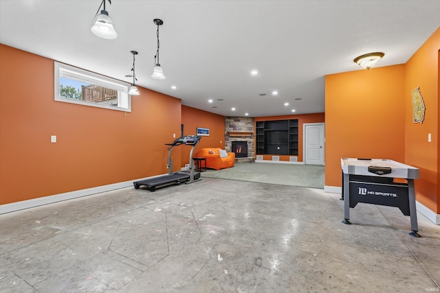 57907 Stone Creek Ct, Goshen, IN 46528 - workout room with baseboards and a fireplace