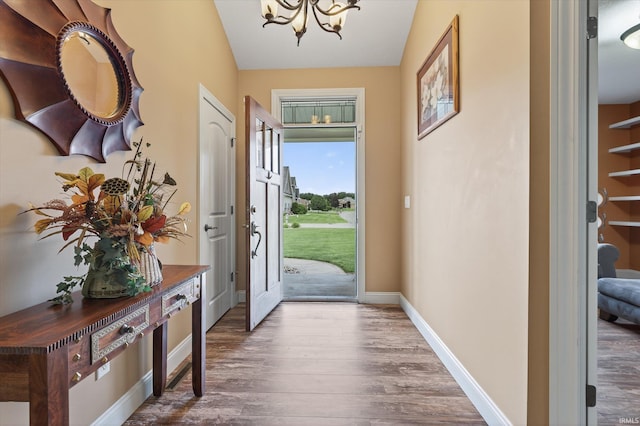 57907 Stone Creek Ct, Goshen, IN 46528 - foyer featuring a chandelier and wood finished floors