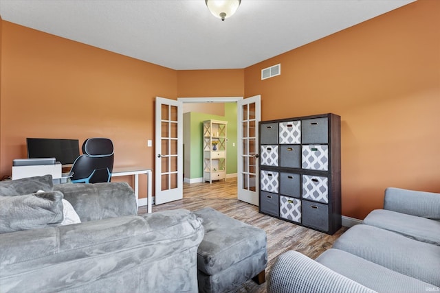 57907 Stone Creek Ct, Goshen, IN 46528 - living area featuring french doors and wood finished floors