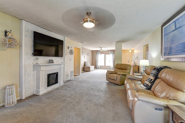 209 N Wilmington Ln, Lafayette, IN 47905 - carpeted living area with a ceiling fan, a fireplace, and a textured ceiling