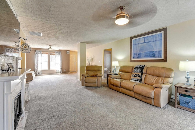 209 N Wilmington Ln, Lafayette, IN 47905 - carpeted living room featuring a textured ceiling, ceiling fan, and a fireplace