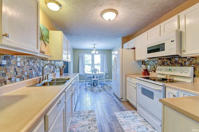 209 N Wilmington Ln, Lafayette, IN 47905 - kitchen with white appliances, light countertops, white cabinets, light wood-style floors, and a textured ceiling