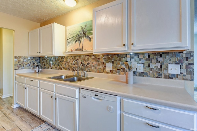 209 N Wilmington Ln, Lafayette, IN 47905 - kitchen featuring white dishwasher, white cabinets, tasteful backsplash, light countertops, and a textured ceiling