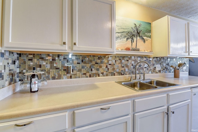209 N Wilmington Ln, Lafayette, IN 47905 - kitchen featuring white cabinetry, light countertops, and tasteful backsplash
