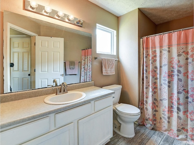 209 N Wilmington Ln, Lafayette, IN 47905 - bathroom with vanity, wood finished floors, and a textured ceiling