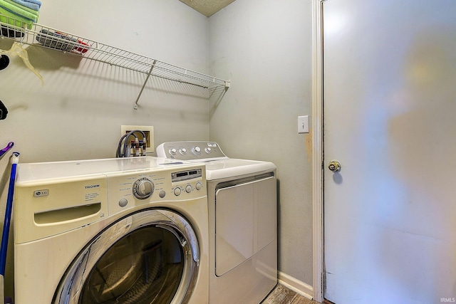 209 N Wilmington Ln, Lafayette, IN 47905 - laundry room featuring separate washer and dryer and wood finished floors