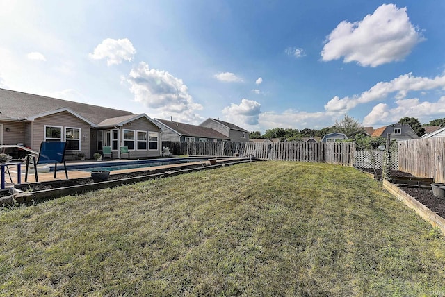 209 N Wilmington Ln, Lafayette, IN 47905 - fenced backyard featuring a patio area and a sunroom
