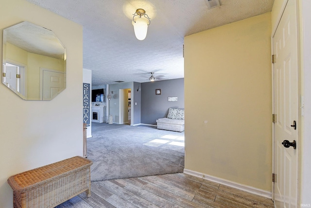 209 N Wilmington Ln, Lafayette, IN 47905 - hallway featuring a textured ceiling, wood finished floors, and carpet