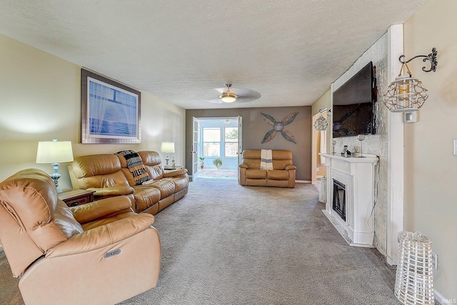 209 N Wilmington Ln, Lafayette, IN 47905 - living area featuring carpet floors, a textured ceiling, a fireplace, and a ceiling fan