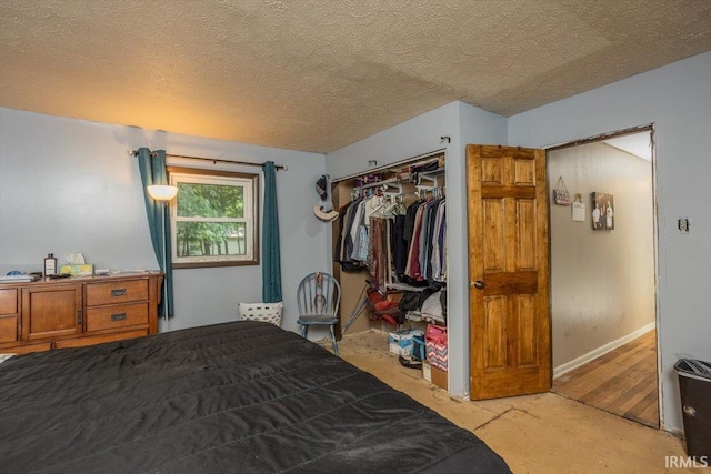6943 Main St, West Point, IN 47992 - bedroom featuring a closet and a textured ceiling