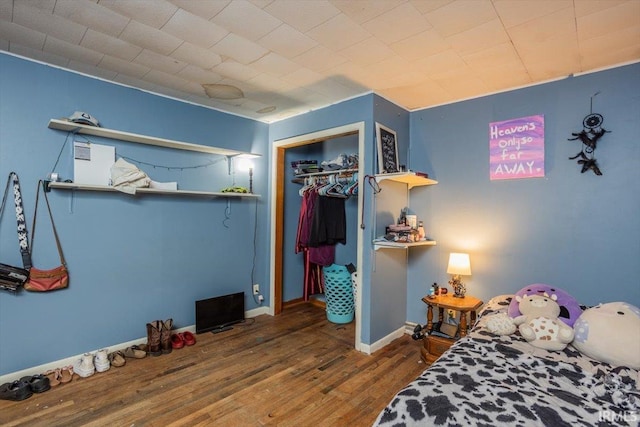 6943 Main St, West Point, IN 47992 - bedroom featuring wood finished floors and a closet