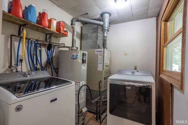 6943 Main St, West Point, IN 47992 - laundry area featuring gas water heater, washer and clothes dryer, and wood finished floors