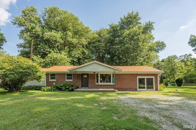 6943 Main St, West Point, IN 47992 - single story home with a front yard, a porch, brick siding, a metal roof, and a standing seam roof