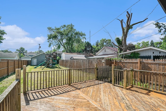 805 S 8th St, Goshen, IN 46516 - wooden terrace with a playground, a fenced backyard, and a shed