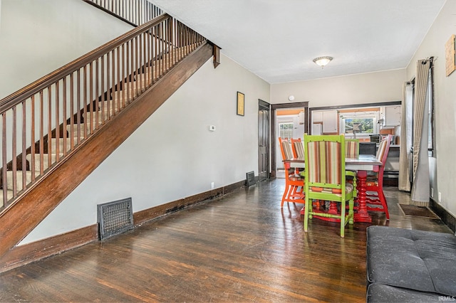 805 S 8th St, Goshen, IN 46516 - dining space featuring wood finished floors and stairs