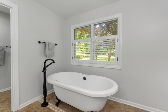 7415 Witling Blvd, Roanoke, IN 46783 - full bathroom with a freestanding bath and tile patterned flooring