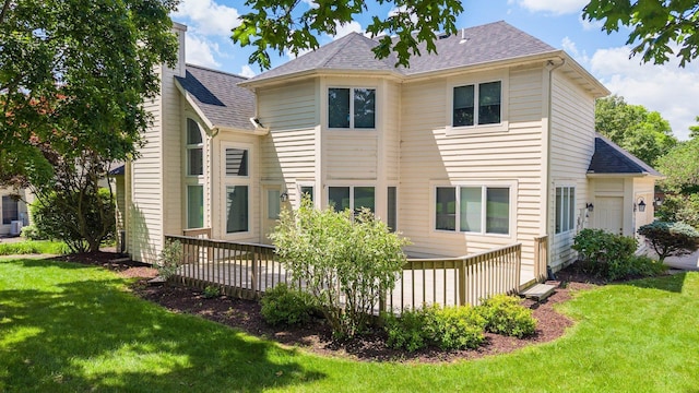 7415 Witling Blvd, Roanoke, IN 46783 - rear view of property featuring a lawn, roof with shingles, and a wooden deck