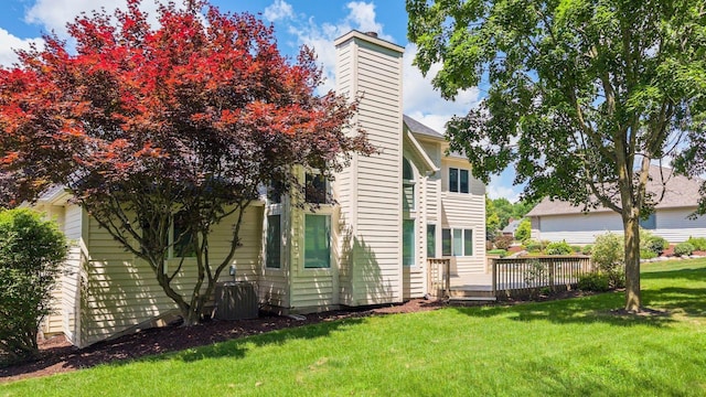 7415 Witling Blvd, Roanoke, IN 46783 - rear view of property featuring a yard, a deck, and a chimney