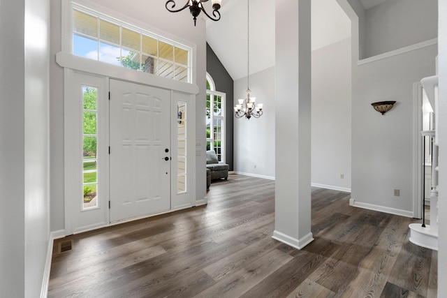 7415 Witling Blvd, Roanoke, IN 46783 - foyer entrance featuring a chandelier, high vaulted ceiling, and dark wood-style flooring