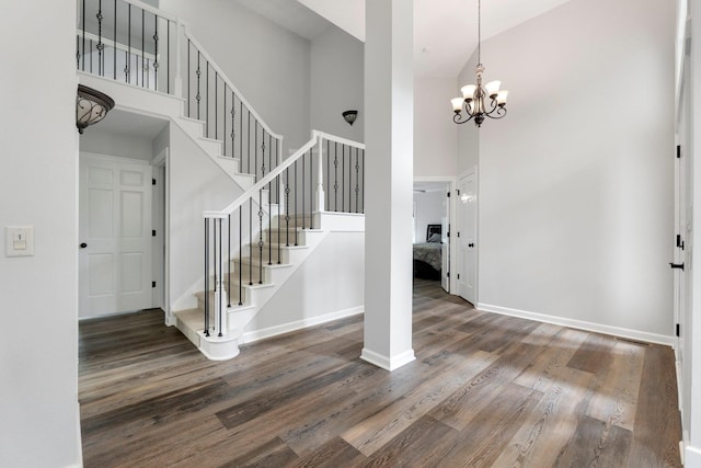 7415 Witling Blvd, Roanoke, IN 46783 - foyer entrance with a towering ceiling, wood finished floors, stairs, and a chandelier