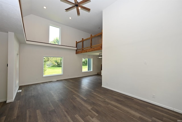 719 N Hathaway St, Winamac, IN 46996 - unfurnished living room featuring ceiling fan, high vaulted ceiling, dark wood finished floors, and recessed lighting