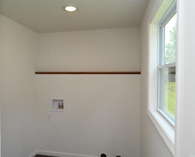 719 N Hathaway St, Winamac, IN 46996 - laundry room featuring washer hookup and baseboards