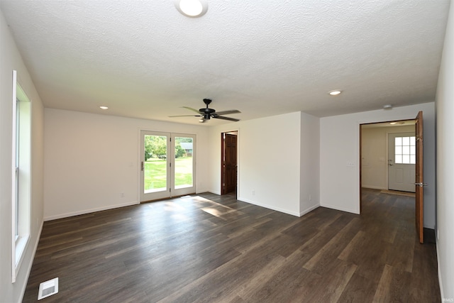 719 N Hathaway St, Winamac, IN 46996 - unfurnished room featuring dark wood-type flooring, a ceiling fan, recessed lighting, and a textured ceiling
