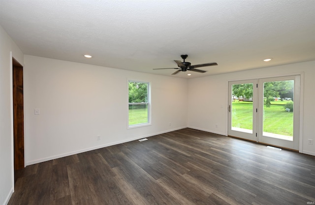 719 N Hathaway St, Winamac, IN 46996 - empty room featuring healthy amount of natural light, dark wood-type flooring, ceiling fan, and recessed lighting