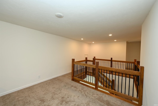 719 N Hathaway St, Winamac, IN 46996 - hallway featuring an upstairs landing, carpet, and recessed lighting
