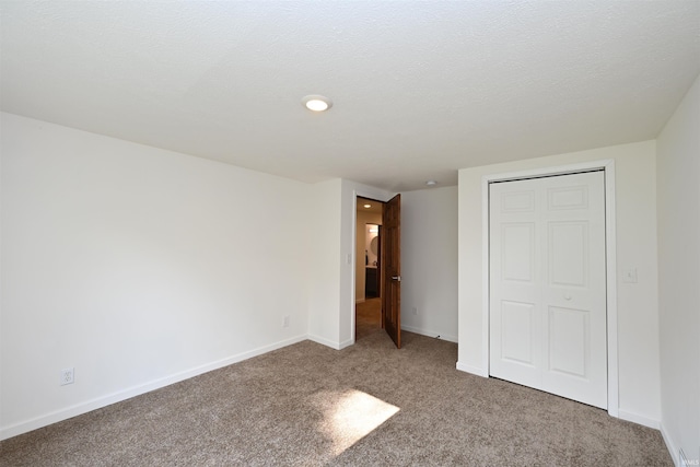 719 N Hathaway St, Winamac, IN 46996 - unfurnished bedroom featuring carpet flooring and a closet