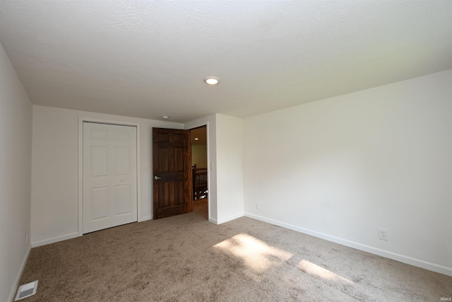 719 N Hathaway St, Winamac, IN 46996 - unfurnished bedroom with carpet and recessed lighting