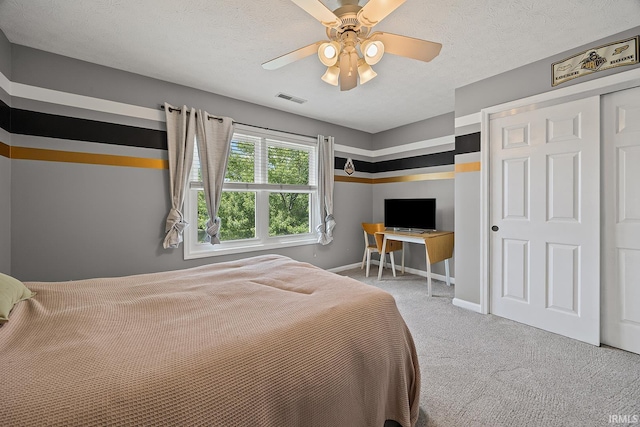 1709 Stonegate Cir, Lafayette, IN 47909 - bedroom with carpet floors, a ceiling fan, a textured ceiling, and a closet