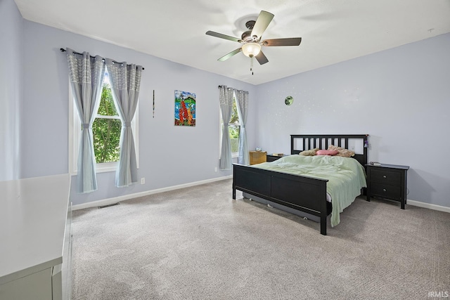 1709 Stonegate Cir, Lafayette, IN 47909 - carpeted bedroom with baseboards and a ceiling fan
