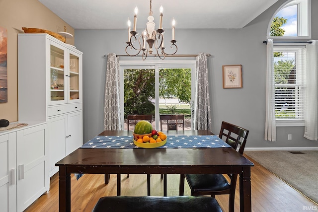 1709 Stonegate Cir, Lafayette, IN 47909 - dining room featuring a chandelier and light wood-style floors